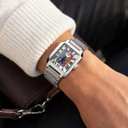 Festina Freedom 29 mm on wrist — hand-painted street-art dial featuring graffiti lettering and stencil figures on a rectangular stainless-steel case with integrated bracelet. Limited edition by IFL Watches.