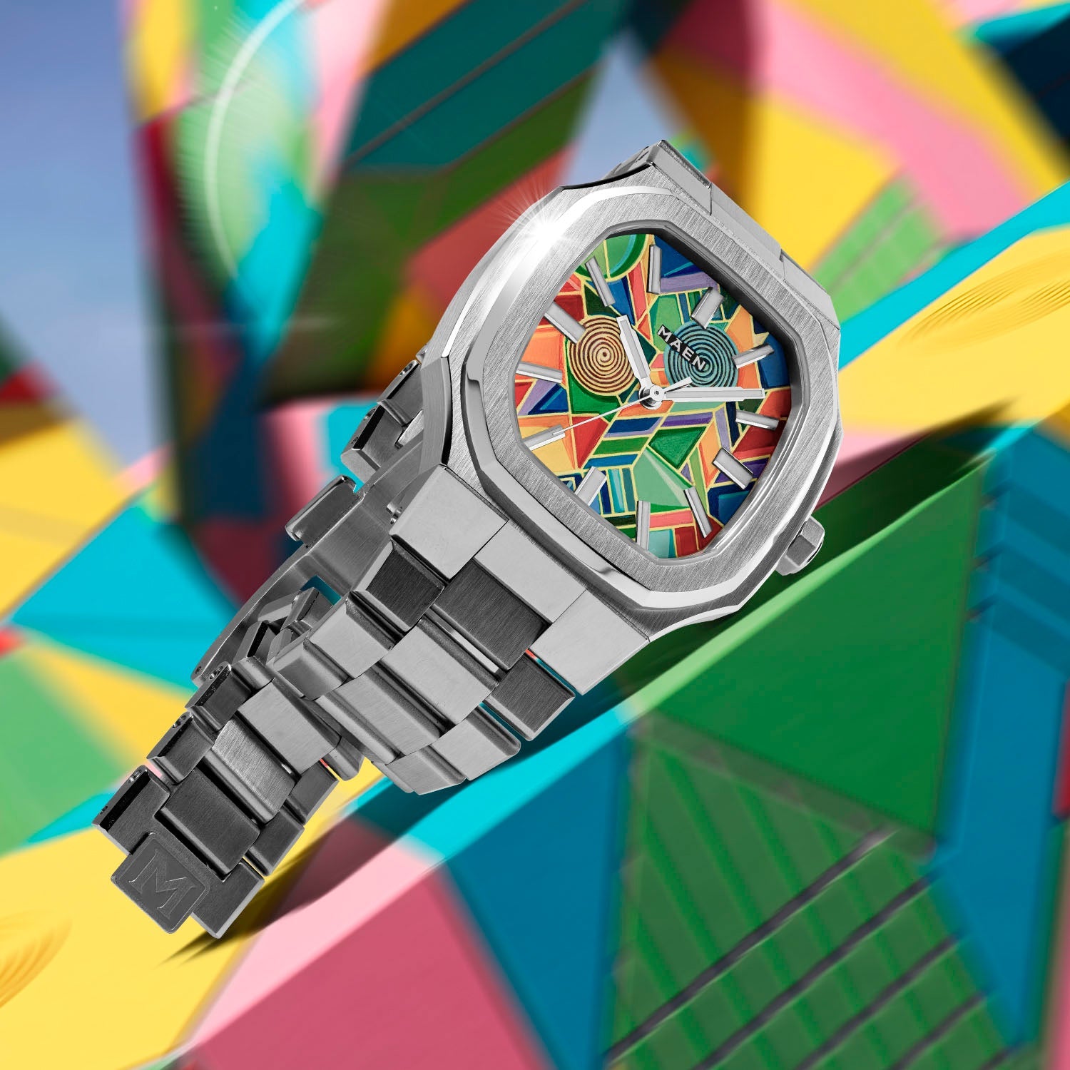 MAEN Manhattan Paradox — hand-painted geometric color-block dial with chevrons, mesh, and two concentric disks on a 37mm octagonal stainless steel case with integrated bracelet, limited edition timepiece by IFL Watches.
