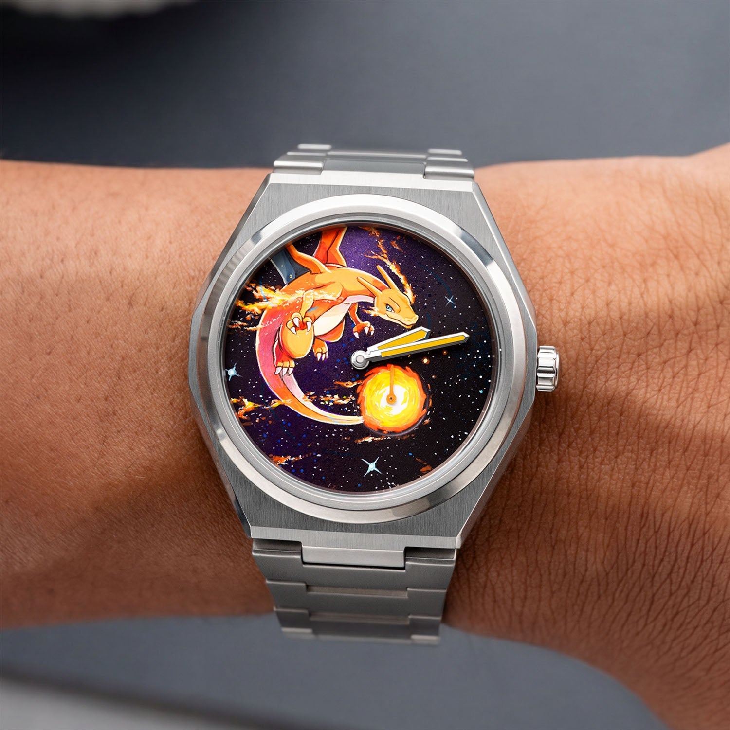 Defiant Inferno Concept on wrist — top-down view of the hand-painted fire-breathing icon on a cosmic black dial with a blazing orb in the small-seconds register, 40.5mm Super Titanium™ case, a bespoke timepiece by IFL Watches.