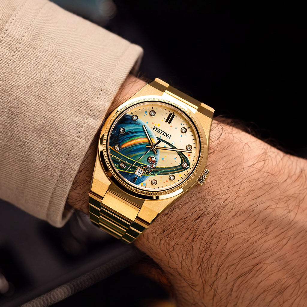 Festina Rive Space Ollie — Bespoke 40mm gold-tone watch worn on the wrist, its hand-painted planet and rider catching light across a sunburst dial, customized exclusively by IFL Watches.