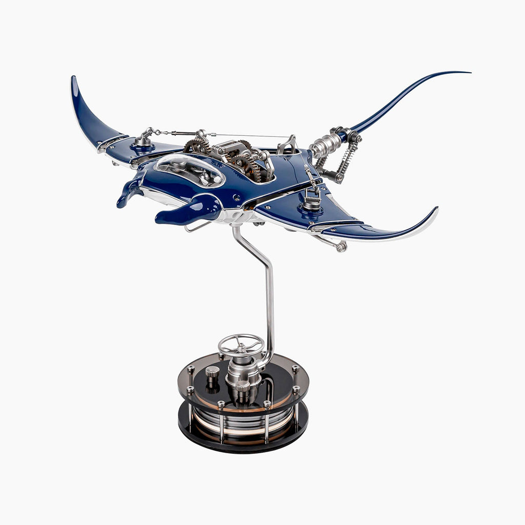 Mecha Ray Blue — the manta with wings raised mid-stroke, a chromed support arm rising from its weighted base, mechanical sculpture by IFL Watches.
