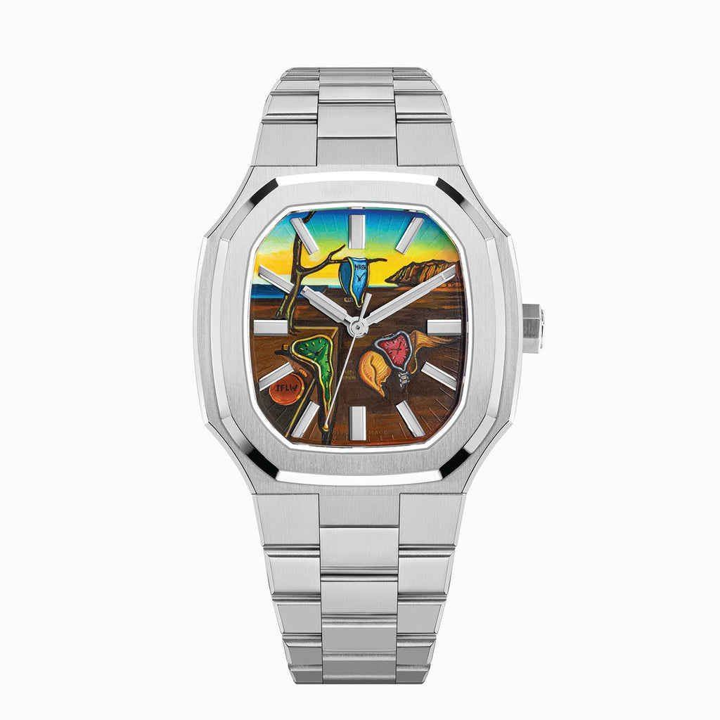 MAEN Manhattan Memento — Hand-painted custom dial with soft watches draped over a bare branch and a stone plinth, a closed watch marked IFLW and golden cliffs under a blue-to-yellow sky, set in a 37mm octagonal stainless steel case on an integrated bracelet, a bespoke timepiece by IFL Watches.