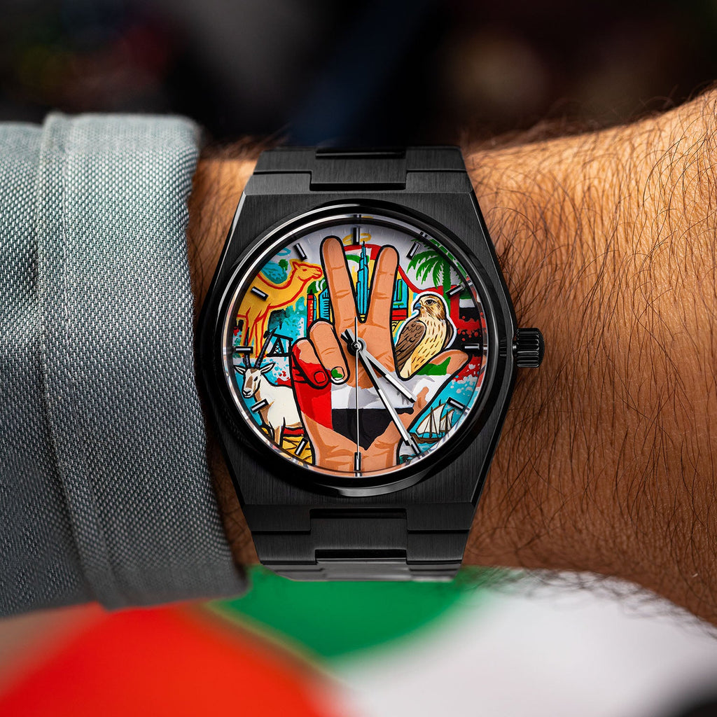 IFL Canvax UAE Unity — Hand-painted custom Canvax featuring the UAE three-finger salute with golden falcon, Arabian oryx, desert camel, and Dubai skyline on a 40mm black matte automatic, a bespoke timepiece by IFL Watches.