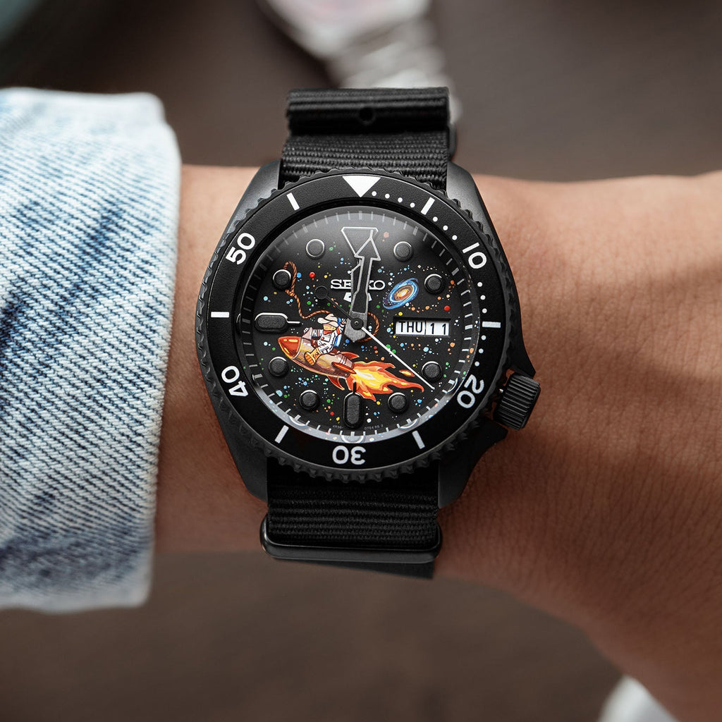Space Cowboy Concept – Hand-painted custom Seiko 5 Sports featuring cosmic cowboy riding rocket through space, bespoke timepiece by IFL Watches
