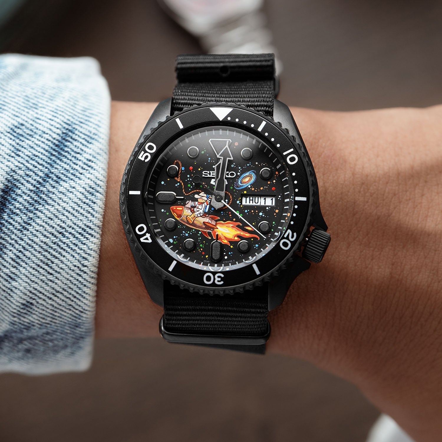 Space Cowboy Concept – Hand-painted custom Seiko 5 Sports featuring cosmic cowboy riding rocket through space, bespoke timepiece by IFL Watches