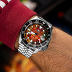 The Red Devils Concept on wrist — top-down view of the hand-painted football crest engulfed in flames on a 42.5mm stainless steel case with black 24-hour GMT bezel, a bespoke timepiece by IFL Watches.