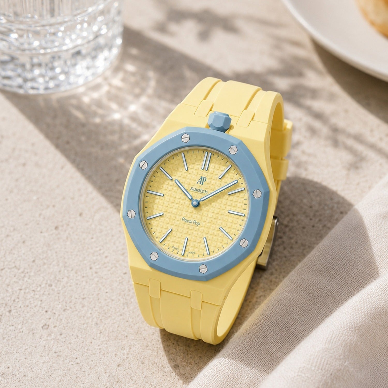 Blaue Acht Swatch × AP Royal Pop Rubber Case-Strap — worn in a tabletop scene, by IFL Watches