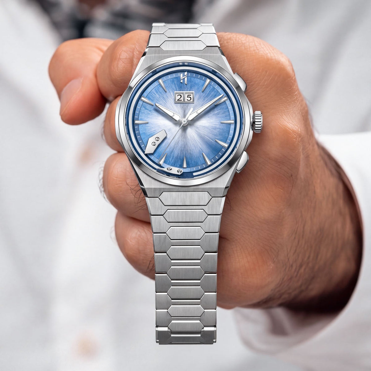 Lucky Harvey Chiming Watch 2.0 Blue — Held in hand, showing the blue dial and big date, available at IFL Watches.
