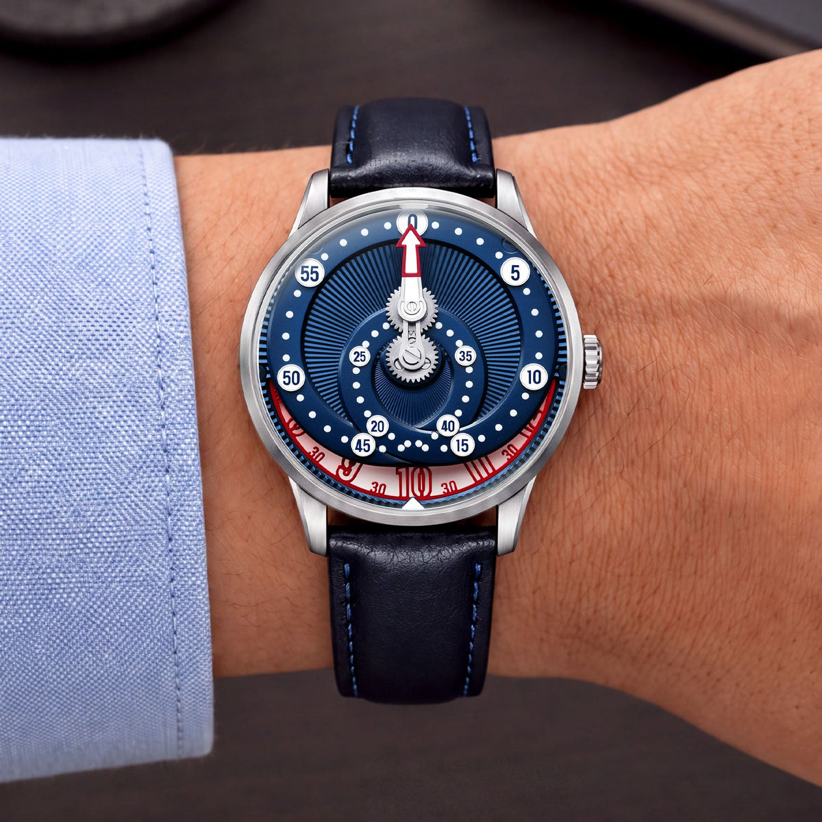 Mandetbrote Orbital Blue Kiss — Worn on wrist with a light cuff, showing the minute arm and hour disc, available at IFL Watches.