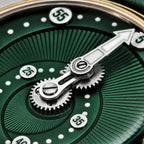 Mandetbrote Orbital Bronze Crush — Macro detail of the geared minute arm over the radiating green dial texture, available at IFL Watches.
