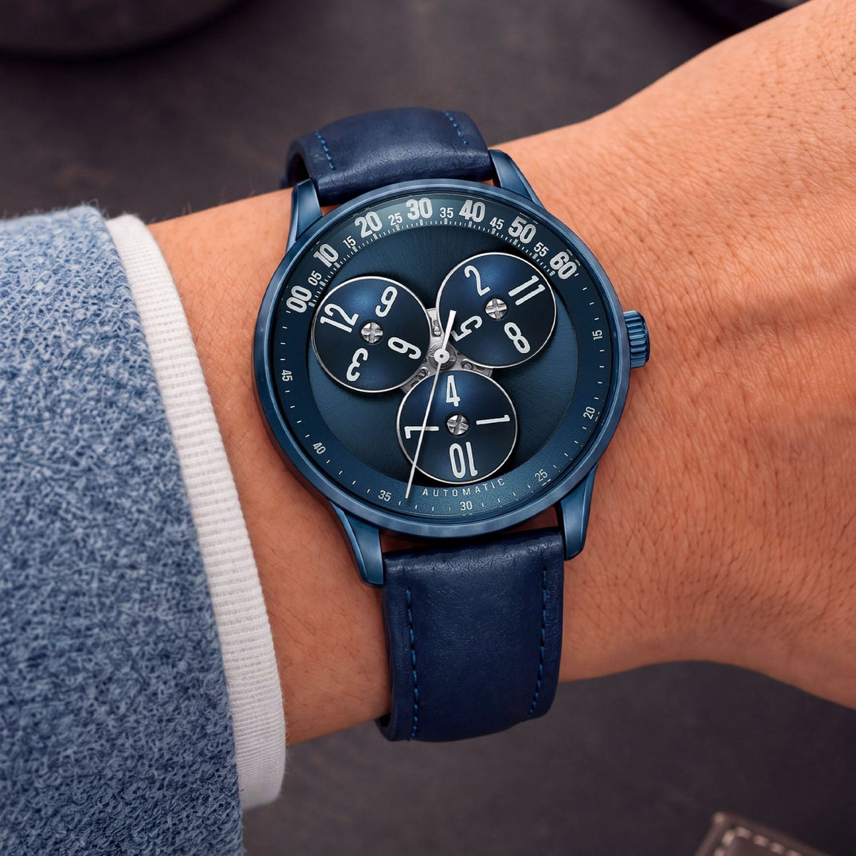 Mandetbrote Wandering Hour Dark Blue — Worn on wrist at an angle, showing the minute arc and hour discs, available at IFL Watches.