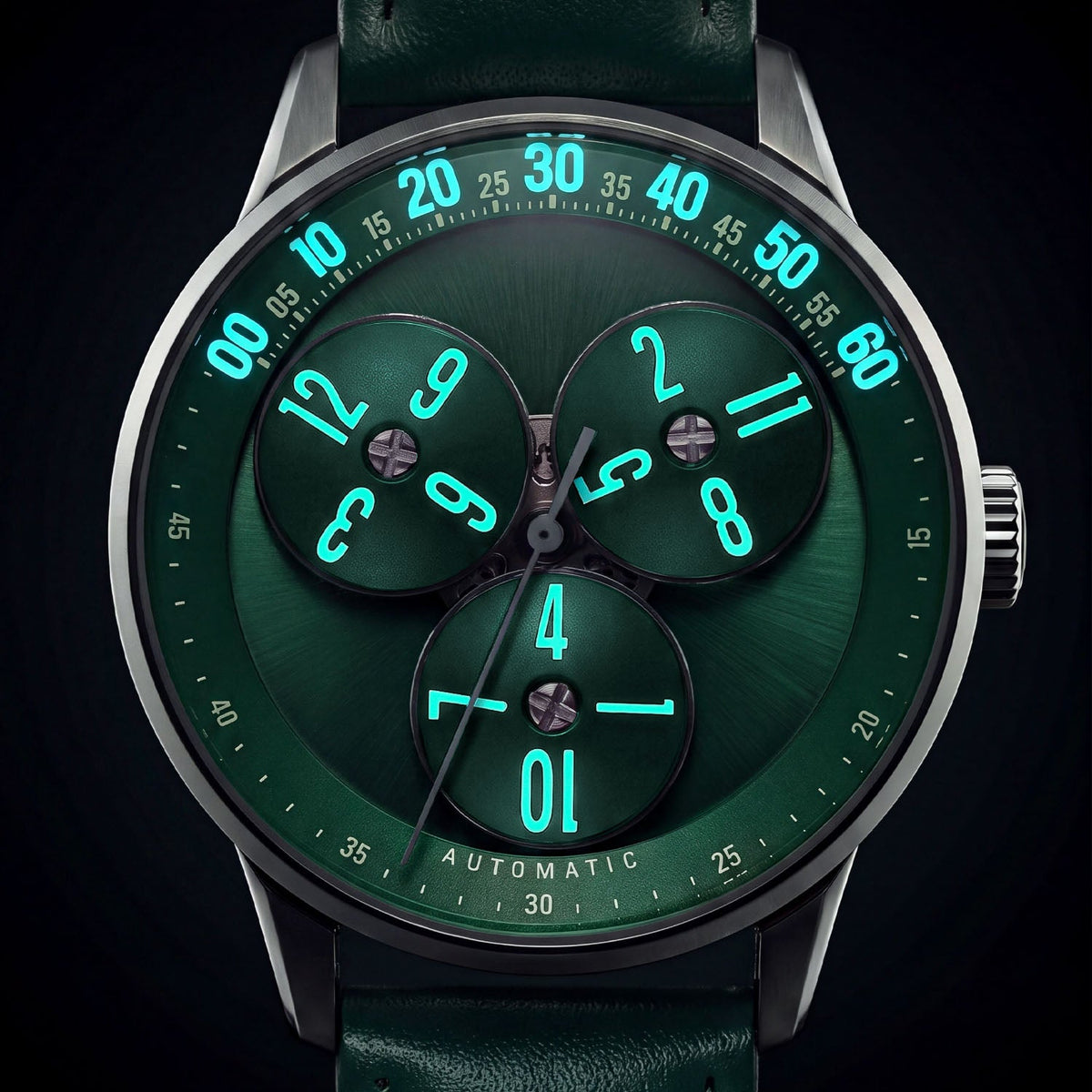 Mandetbrote Wandering Hour Green — In the dark, with the hour numerals and minute track glowing, available at IFL Watches.