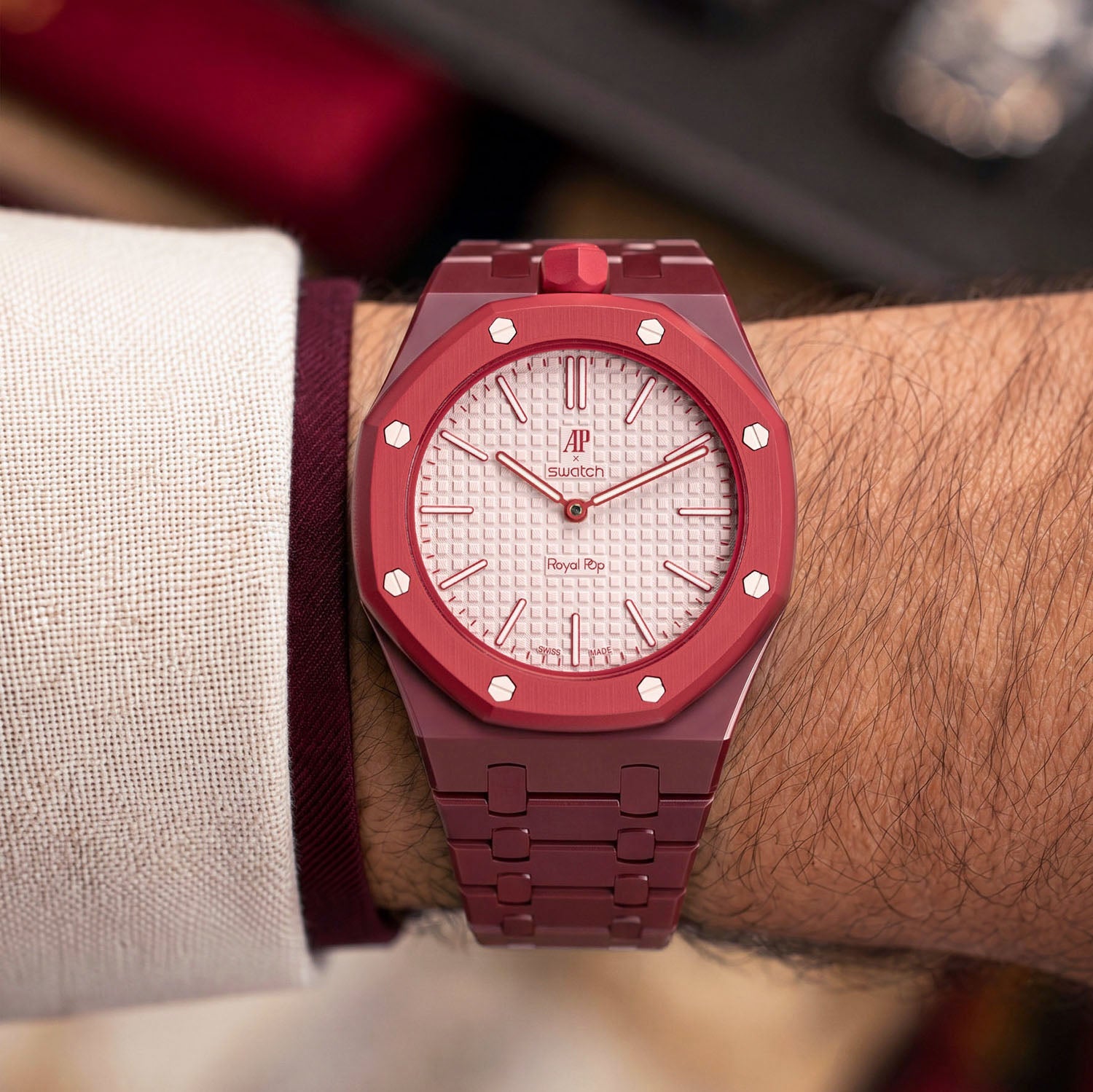 Otto Rosso Swatch × AP Royal Pop Ceramic Case-Strap — worn in a lounge scene, by IFL Watches