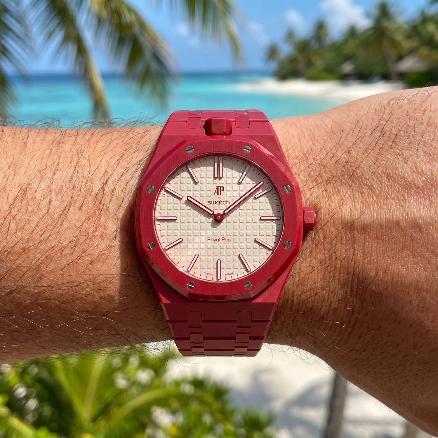 Otto Rosso Swatch × AP Royal Pop Ceramic Case-Strap — worn in a beach scene, by IFL Watches