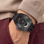 Tsar Bomba Parallax Carbon Black — Worn on wrist with a hand in pocket, seen from a relaxed angle, available at IFL Watches.