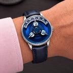Vortichron Timeorb Blue — Worn on wrist at an angle, showing the brushed steel case and crown, available at IFL Watches.