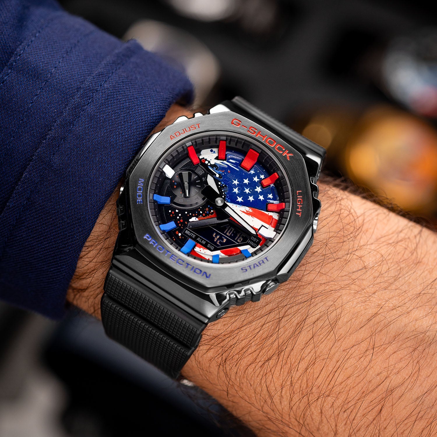 Casio G-Shock Full Metal USA — flag dial with paint-splatter detail shown on the wrist, by IFL Watches